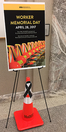 Poster and orange cone displayed in the Transportation Building.